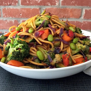 Vegetable Pad Thai: Iconic dish from Thailand. Perfect balance of sweet, sour, and spice. Stir-fried broccoli, peppers, carrots, edamame,  peanuts tossed with Asian noodles and amazing Pad Thai sauce. A Chip and Kale classic. 