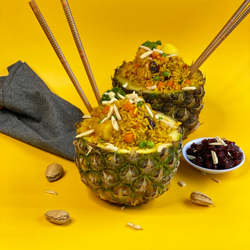 Pineapple Fried Rice Delicious South Asian inspired stir-fry of nutty brown rice, carrots, peas, crunchy almonds, sweet raisins and juicy pineapple stir fried with bold spices develops a rich flavorful exotic combination of sweet heat and spice.