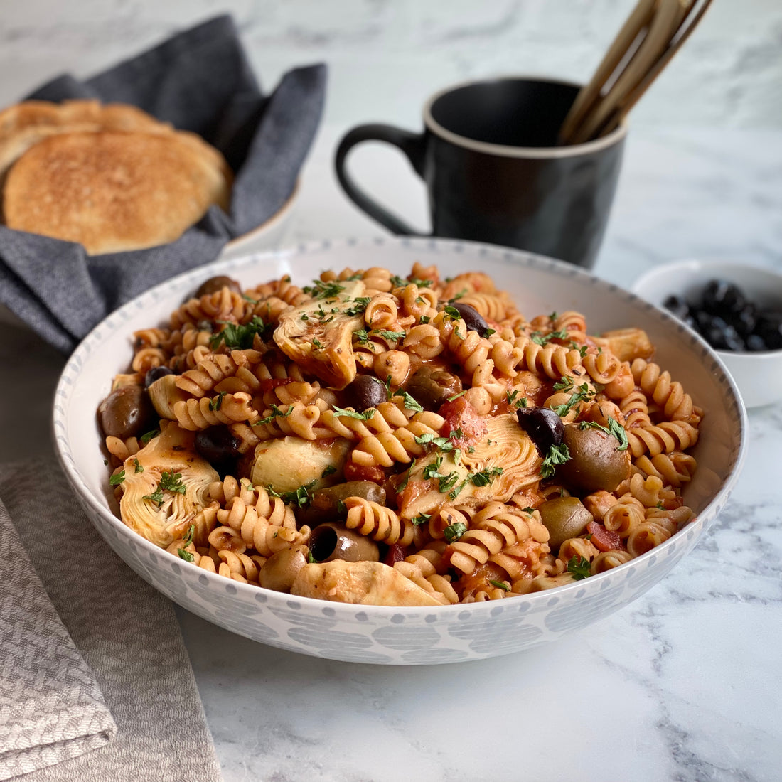 One Pot Greek Pasta   Rich, flavorful, punch of protein one pot wonder. Tender pasta, garlic, olives, artichokes, tomatoes, chickpeas and capers cooked in veggie broth with Mediterranean spices makes easy delicious fun dinner.
